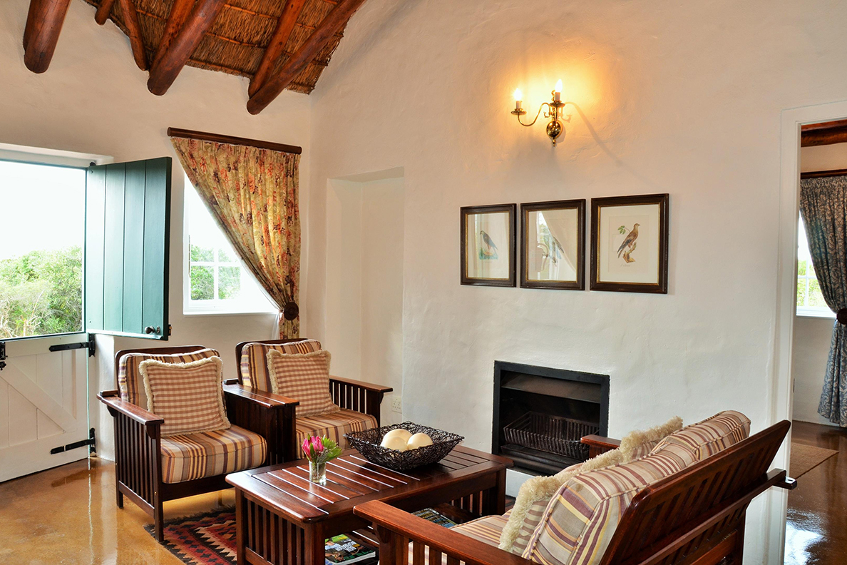 De Hoop - Vlei Cottages Wohnecke mit Cheminée